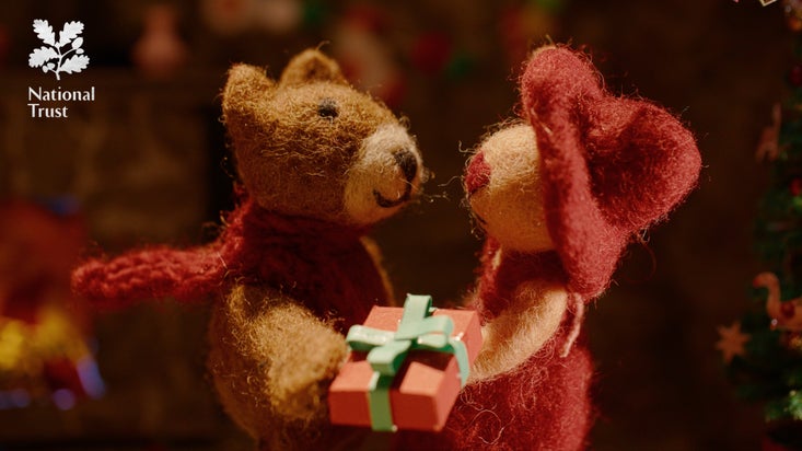 Two Christmas decoration felt mice sharing a present